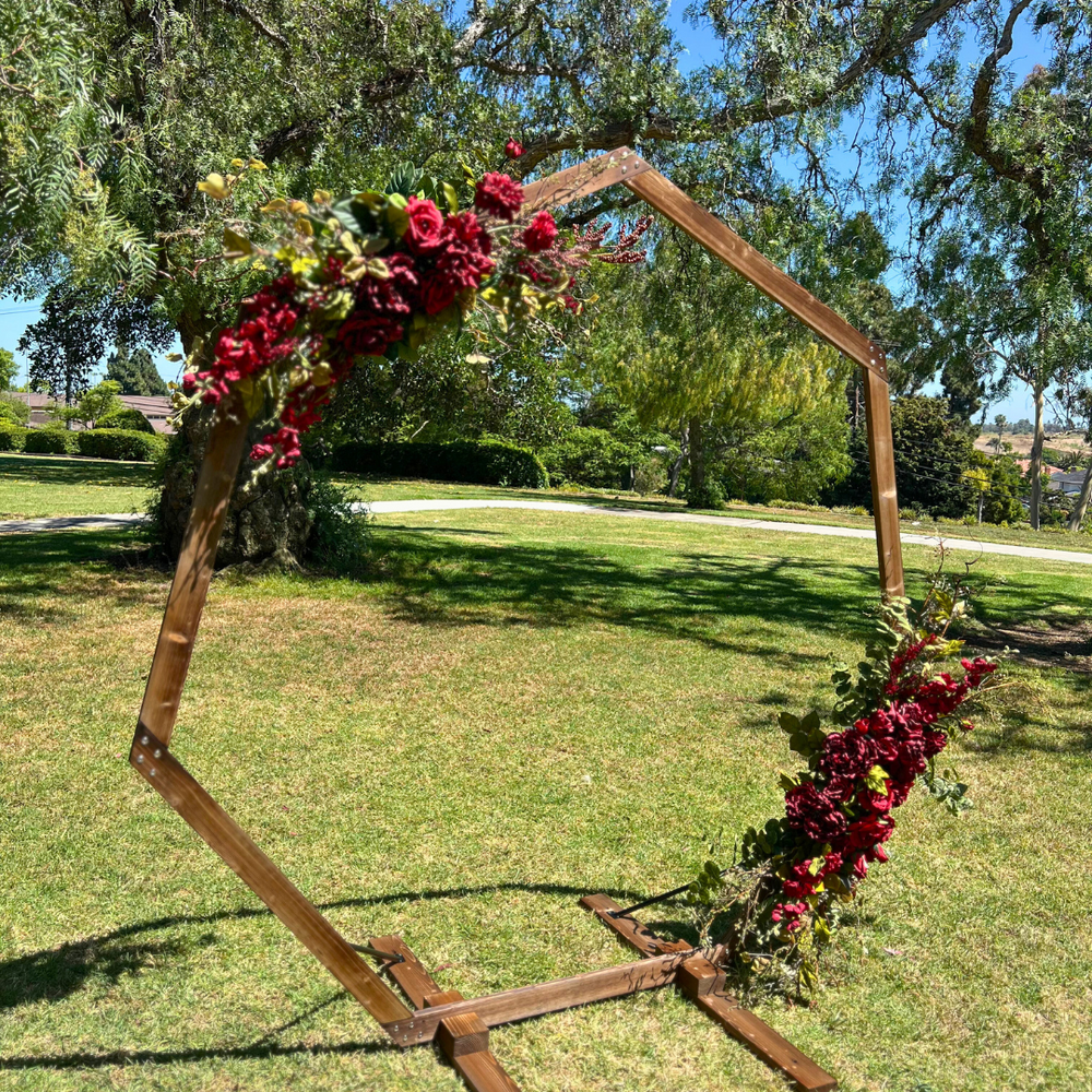 
                      
                        Quinn's Heptagon Floral Arch - Permanence Decor Rentals
                      
                    